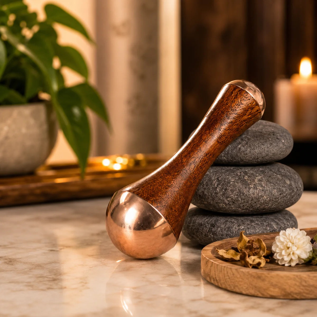 Kansa wooden massager with polished head on marble surface